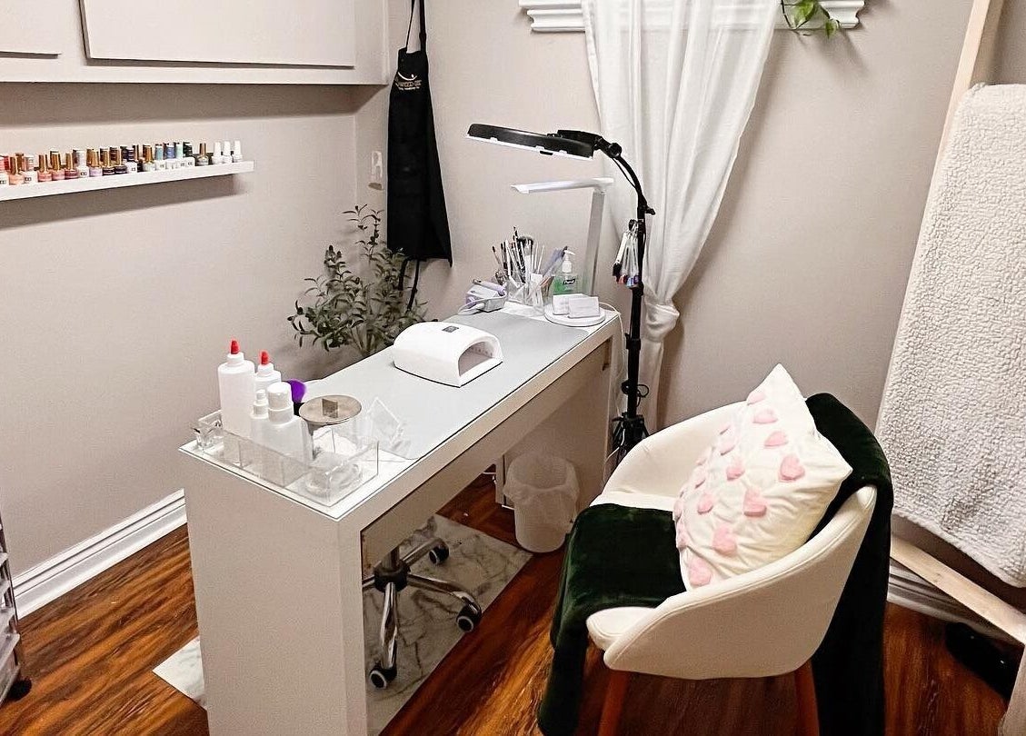 Cozy nail station at The Lacquer Lounge in St. Catharines, Ontario, CA, featuring elegant decor and nail tools.