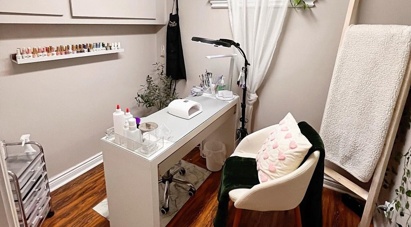 Cozy nail station at The Lacquer Lounge in St. Catharines, Ontario, CA, featuring elegant decor and nail tools.