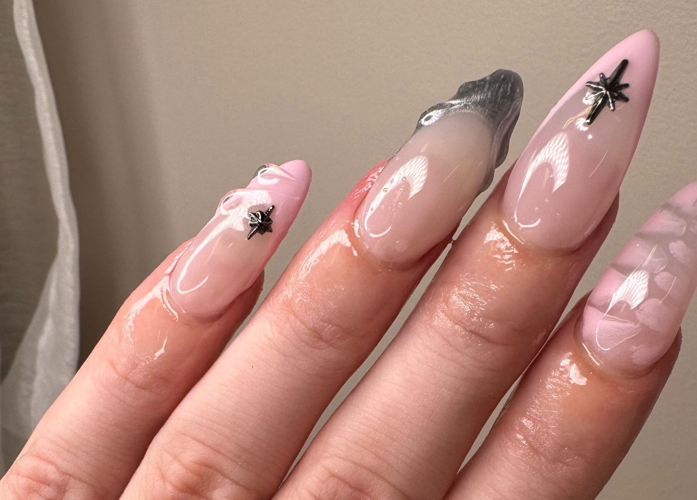 Chic pink nail art with silver accents at The Lacquer Lounge, St. Catharines, Ontario, CA, showcasing modern style.