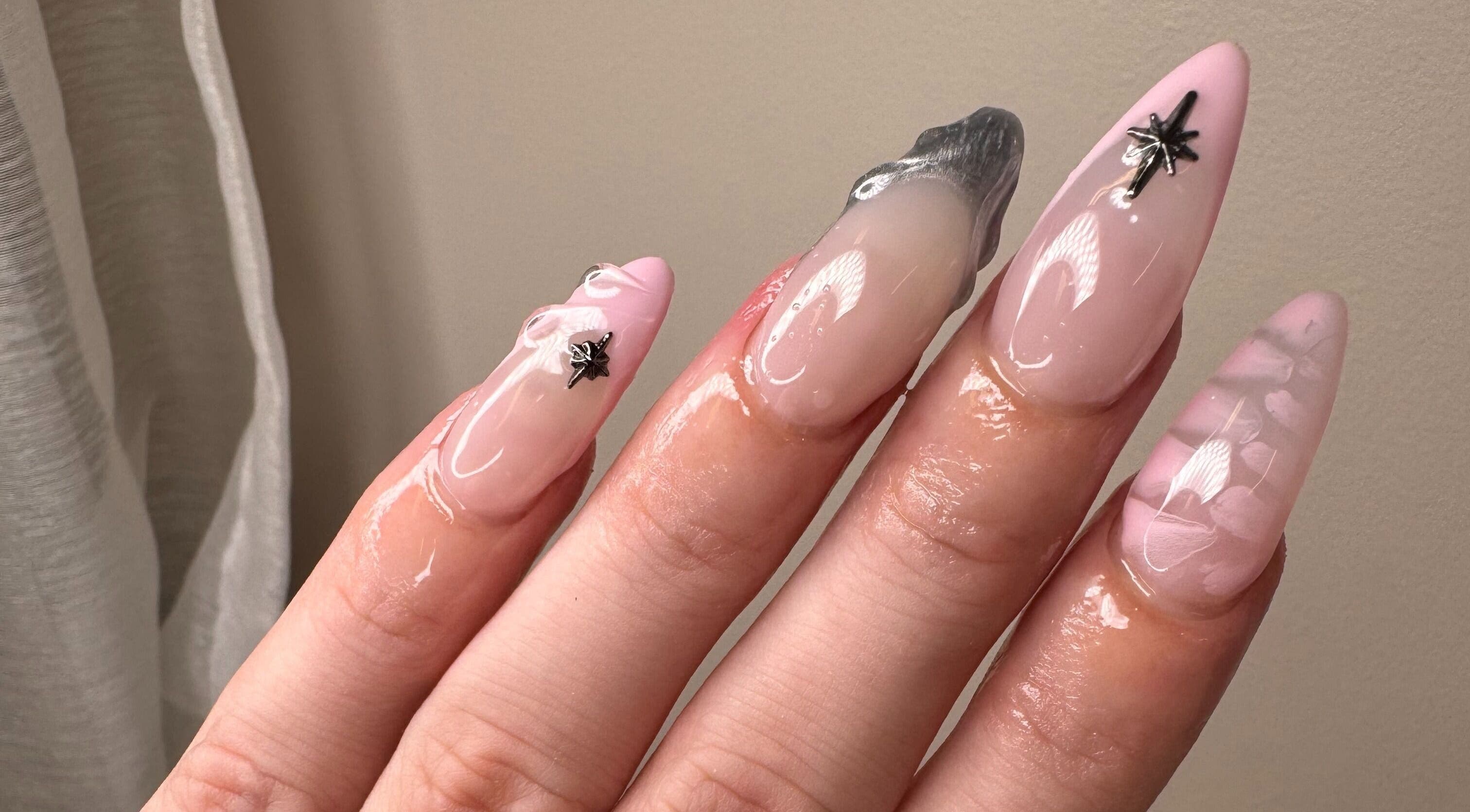 Chic pink nail art with silver accents at The Lacquer Lounge, St. Catharines, Ontario, CA, showcasing modern style.