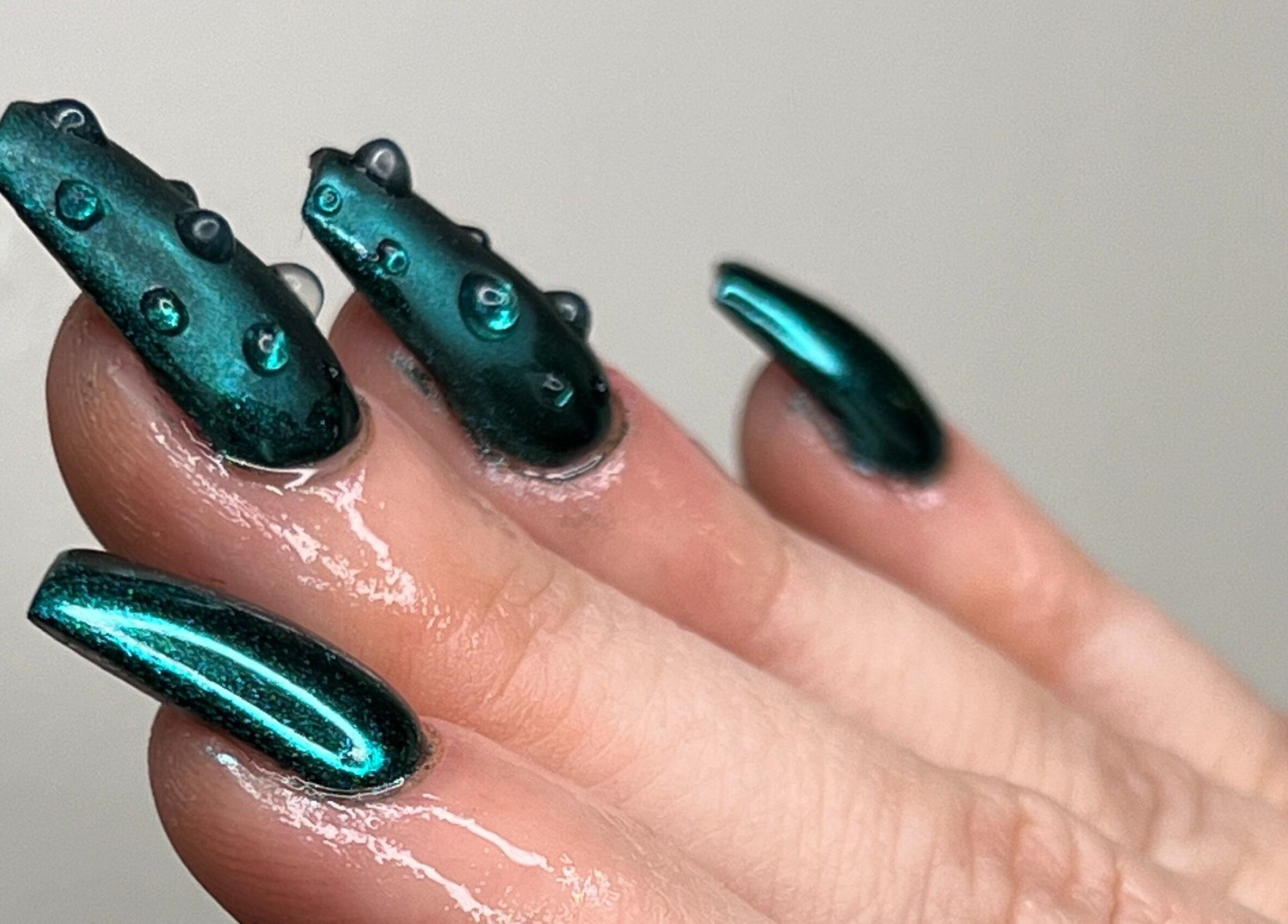 Emerald green nails with water droplets at The Lacquer Lounge, St. Catharines, Ontario, CA.