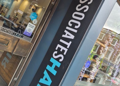 Entrance of Associates Hair Winchester showcasing stylish salon door in Winchester, England, GB.
