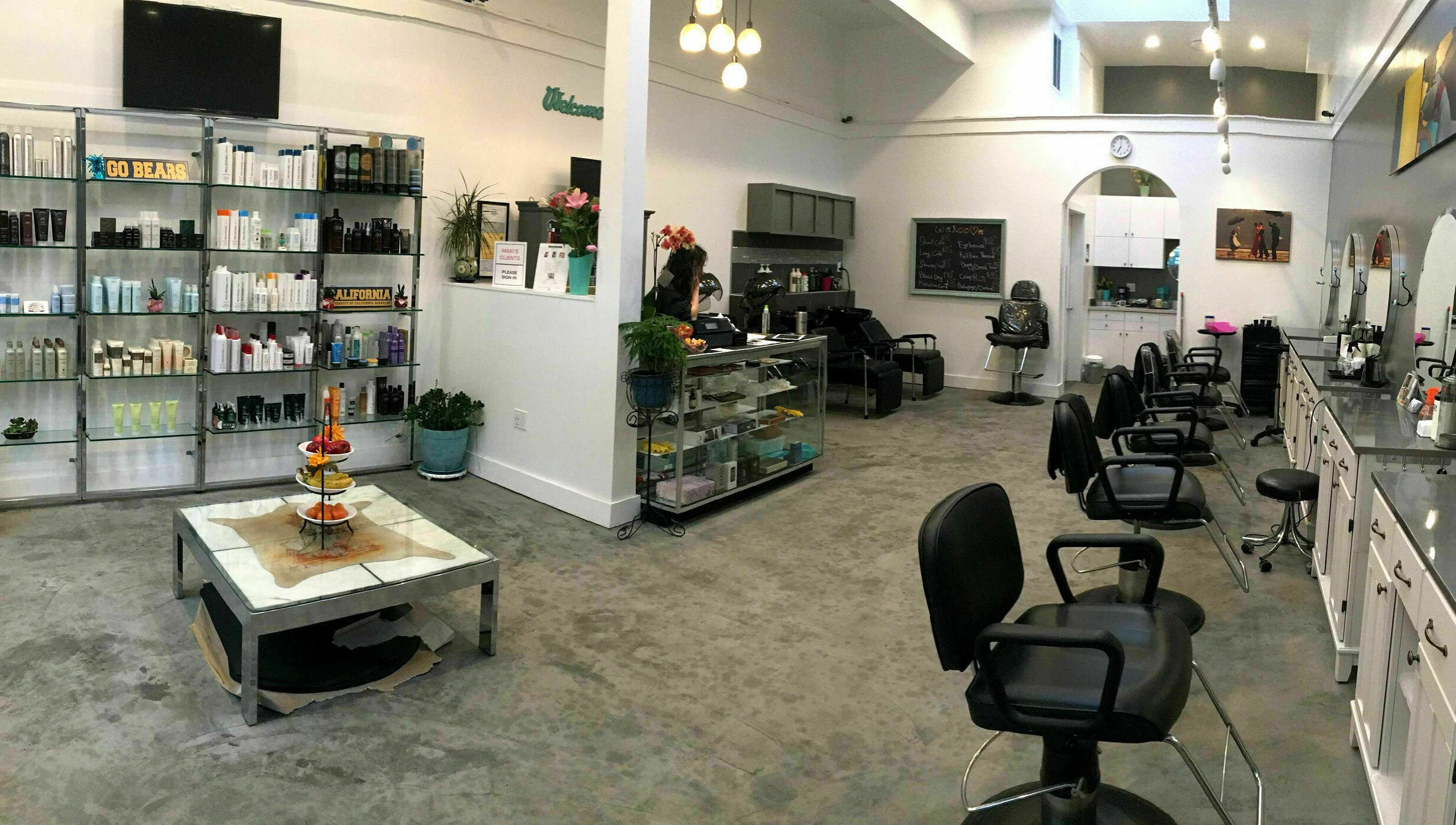 Stylish interior of Maxi Hair Salon in Berkeley, California, US with modern chairs and product display.