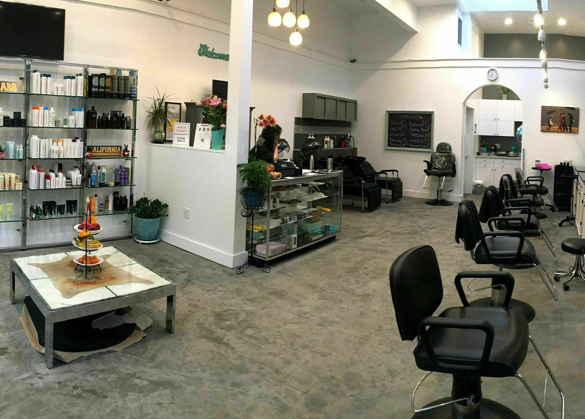 Stylish interior of Maxi Hair Salon in Berkeley, California, US with modern chairs and product display.