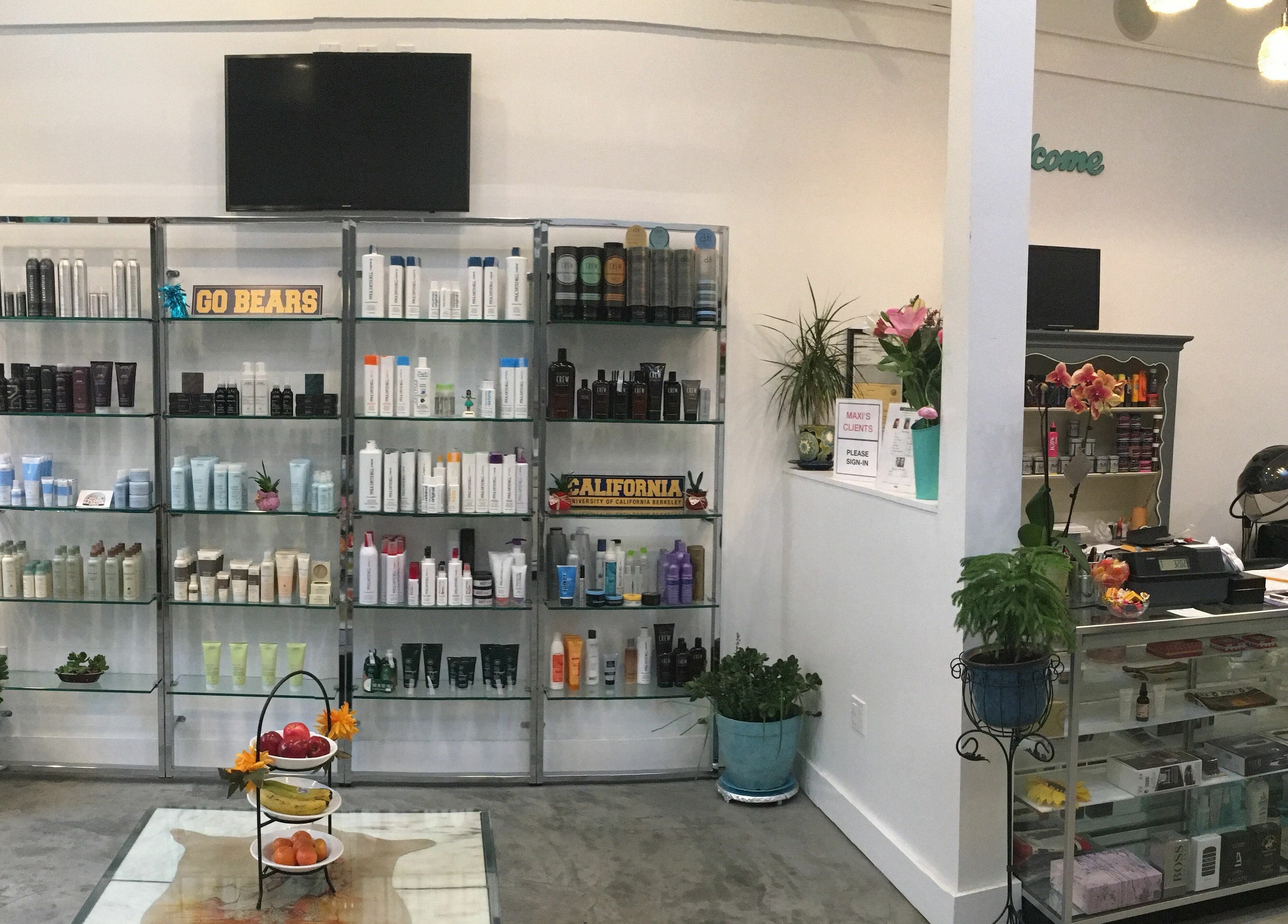 Product display at Maxi Hair Salon, Berkeley, California, US featuring hair care essentials.