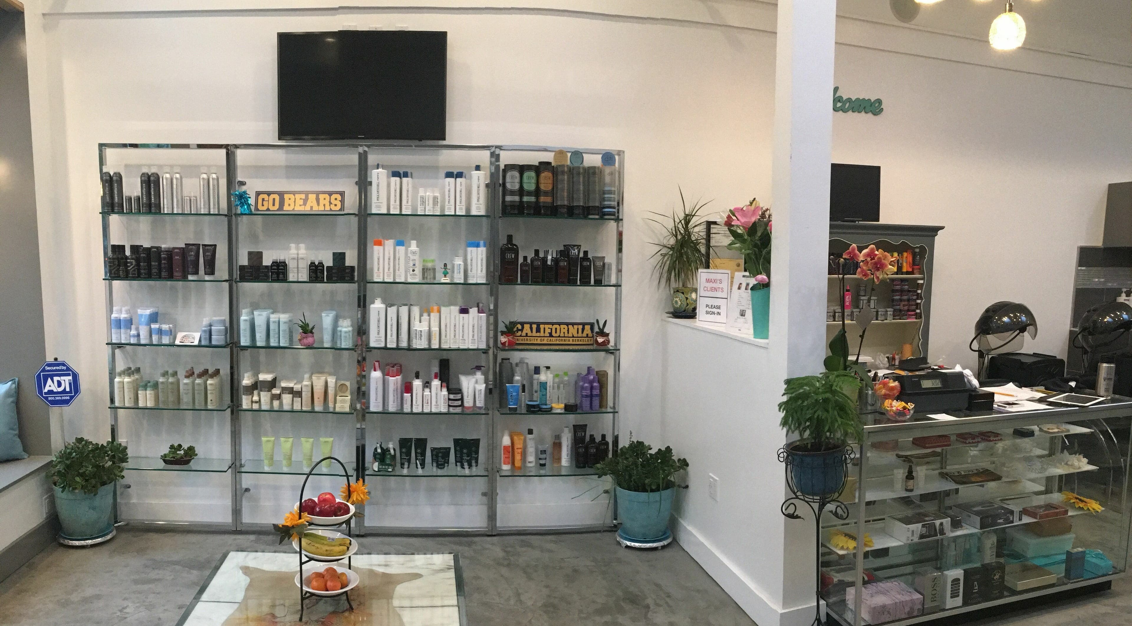 Product display at Maxi Hair Salon, Berkeley, California, US featuring hair care essentials.