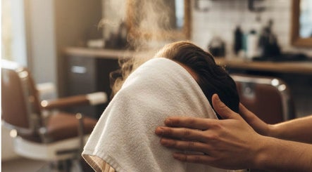 Steaming towel facial treatment at Elite Eight Barbering Co, Saint Stephen, England, GB enhances relaxation.