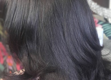 Silky black hairstyle at Elite Eight Barbering Co, Saint Stephen, England, GB.