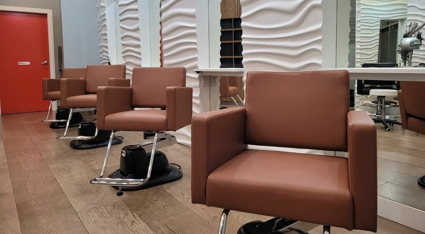 Modern salon chairs at Dr. Park’s Hair Studio, Vancouver, British Columbia, CA with stylish interiors.
