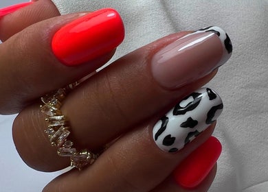 Stylish manicure with red and black-white design at Silvia Vasiliu Nails, STOKE-ON-TRENT, England, GB.