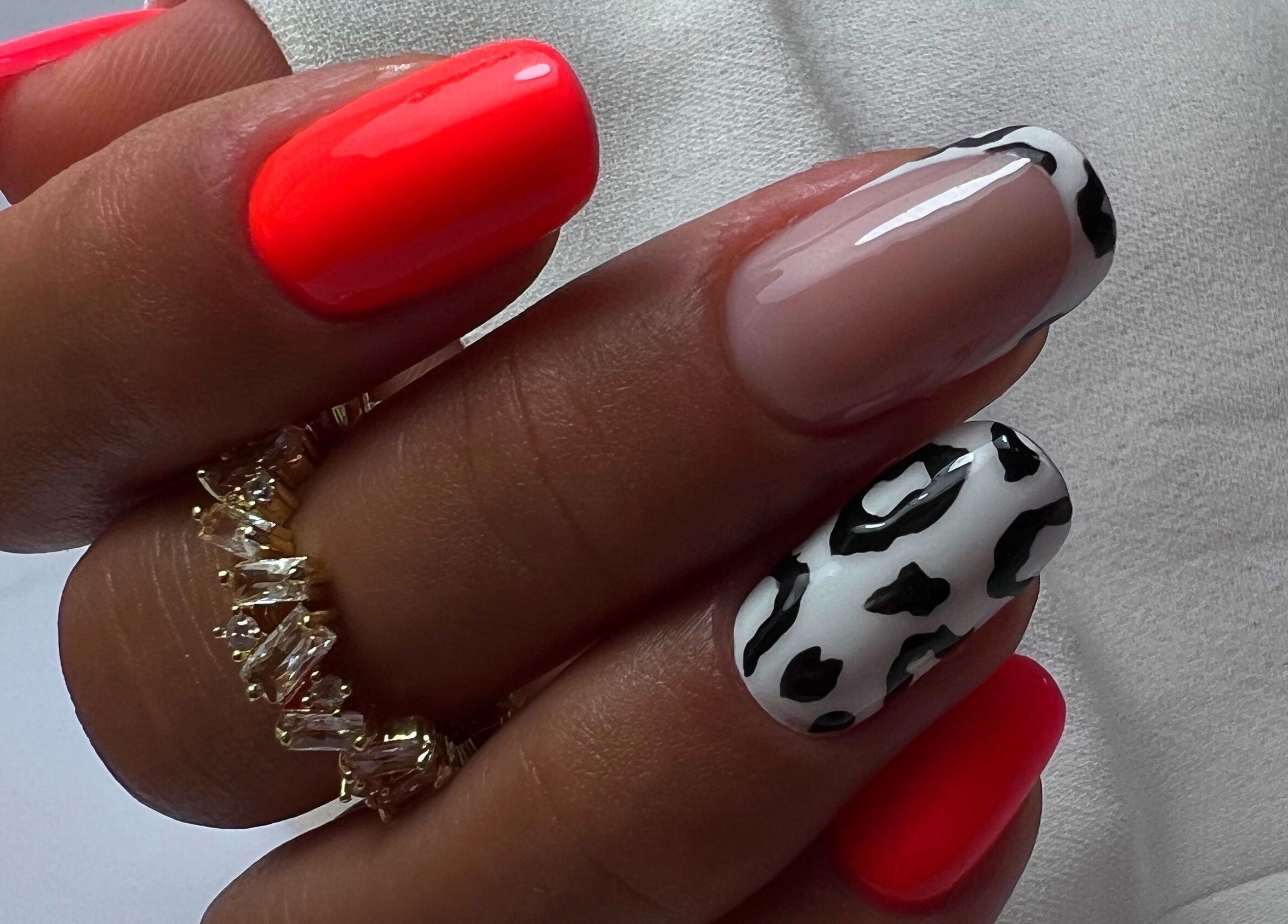Stylish manicure with red and black-white design at Silvia Vasiliu Nails, STOKE-ON-TRENT, England, GB.