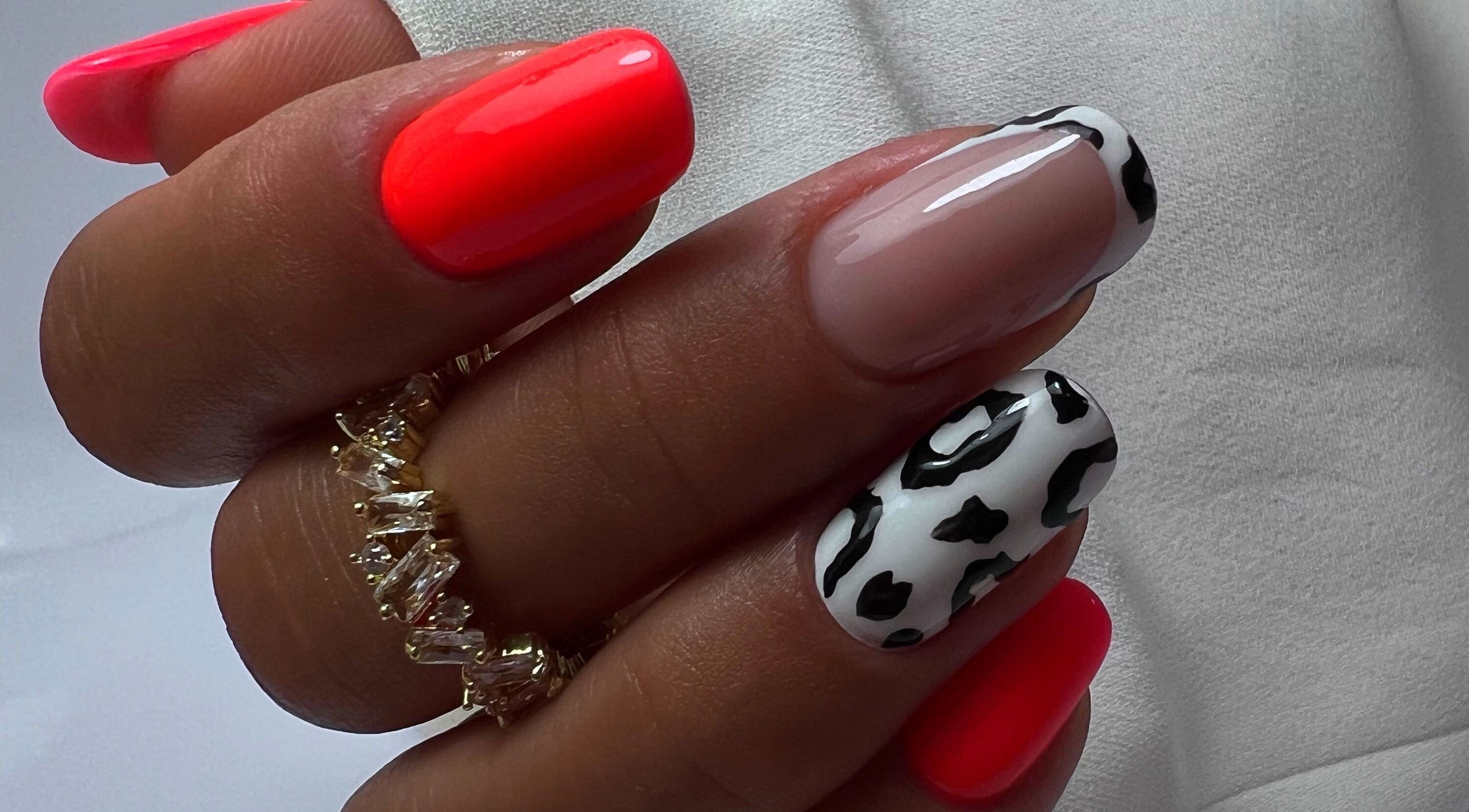 Stylish manicure with red and black-white design at Silvia Vasiliu Nails, STOKE-ON-TRENT, England, GB.