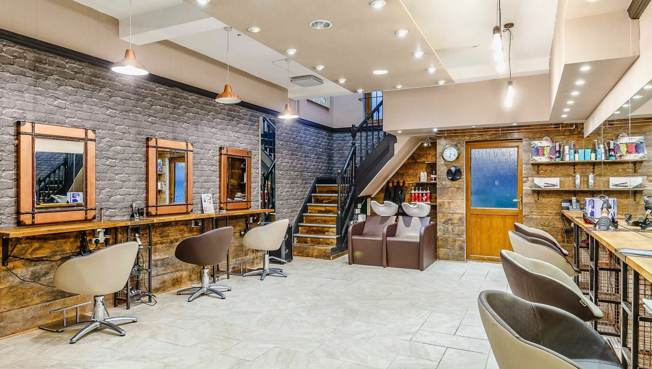 Modern interior of Slix Salon in Swansea, Wales, GB, showcasing stylish styling stations and sleek décor.