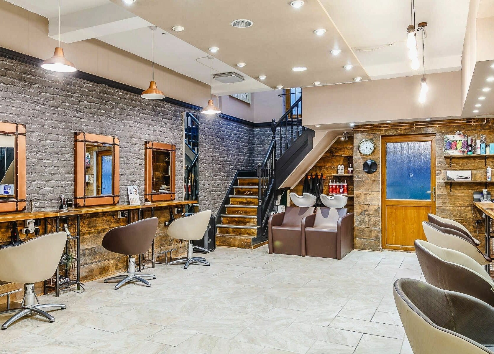Modern interior of Slix Salon in Swansea, Wales, GB, showcasing stylish styling stations and sleek décor.