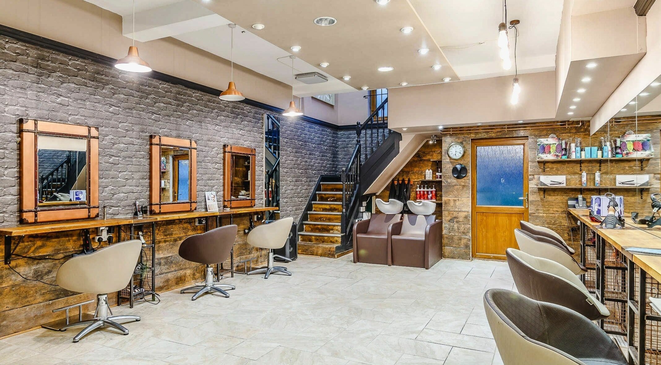 Modern interior of Slix Salon in Swansea, Wales, GB, showcasing stylish styling stations and sleek décor.