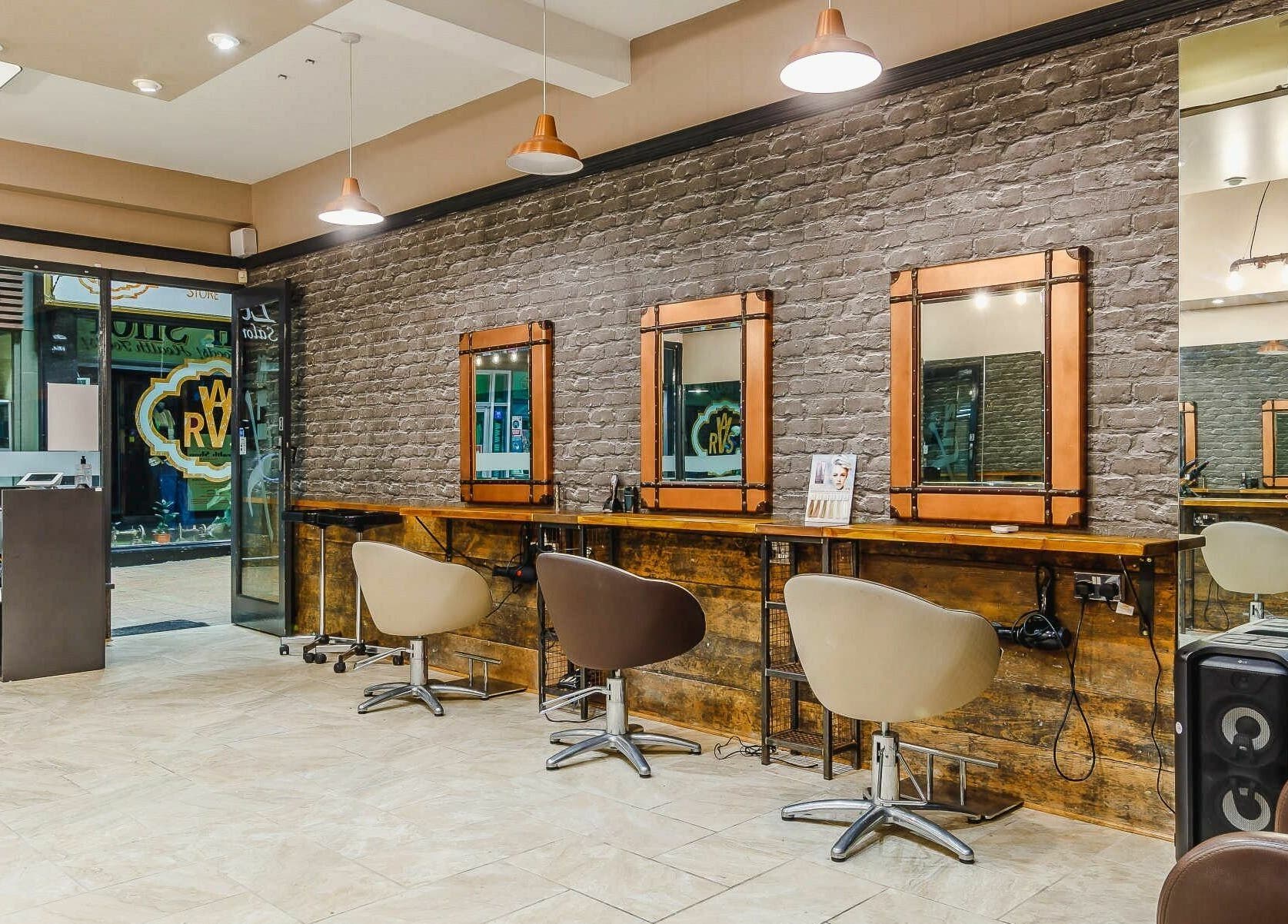 Elegant hair styling stations at Slix Salon, Swansea, Wales, GB, featuring rustic decor and modern design.