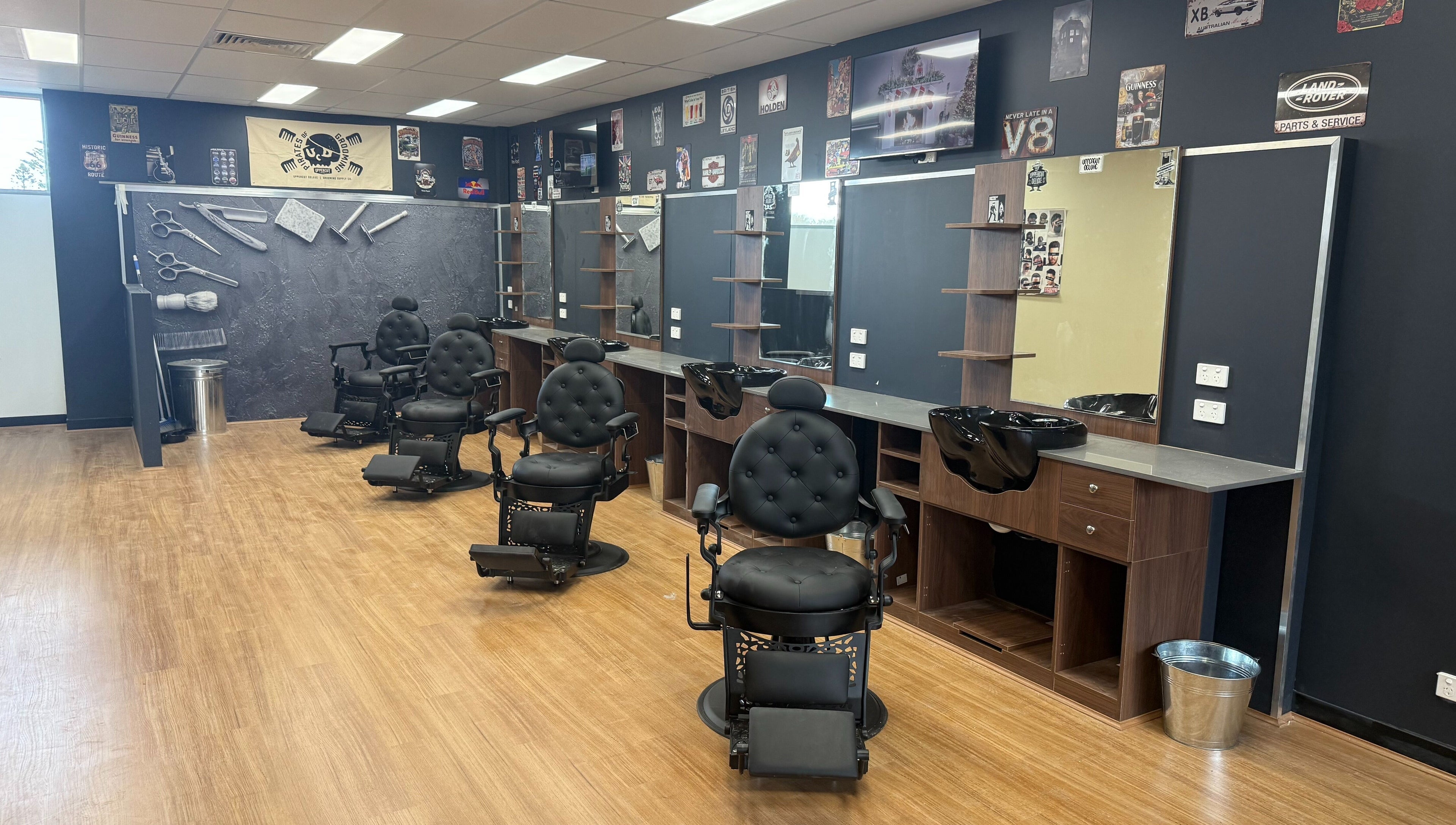 Modern barber chairs and mirrors at The Fade Lounge - Currambine, Western Australia, AU showcasing sleek design.