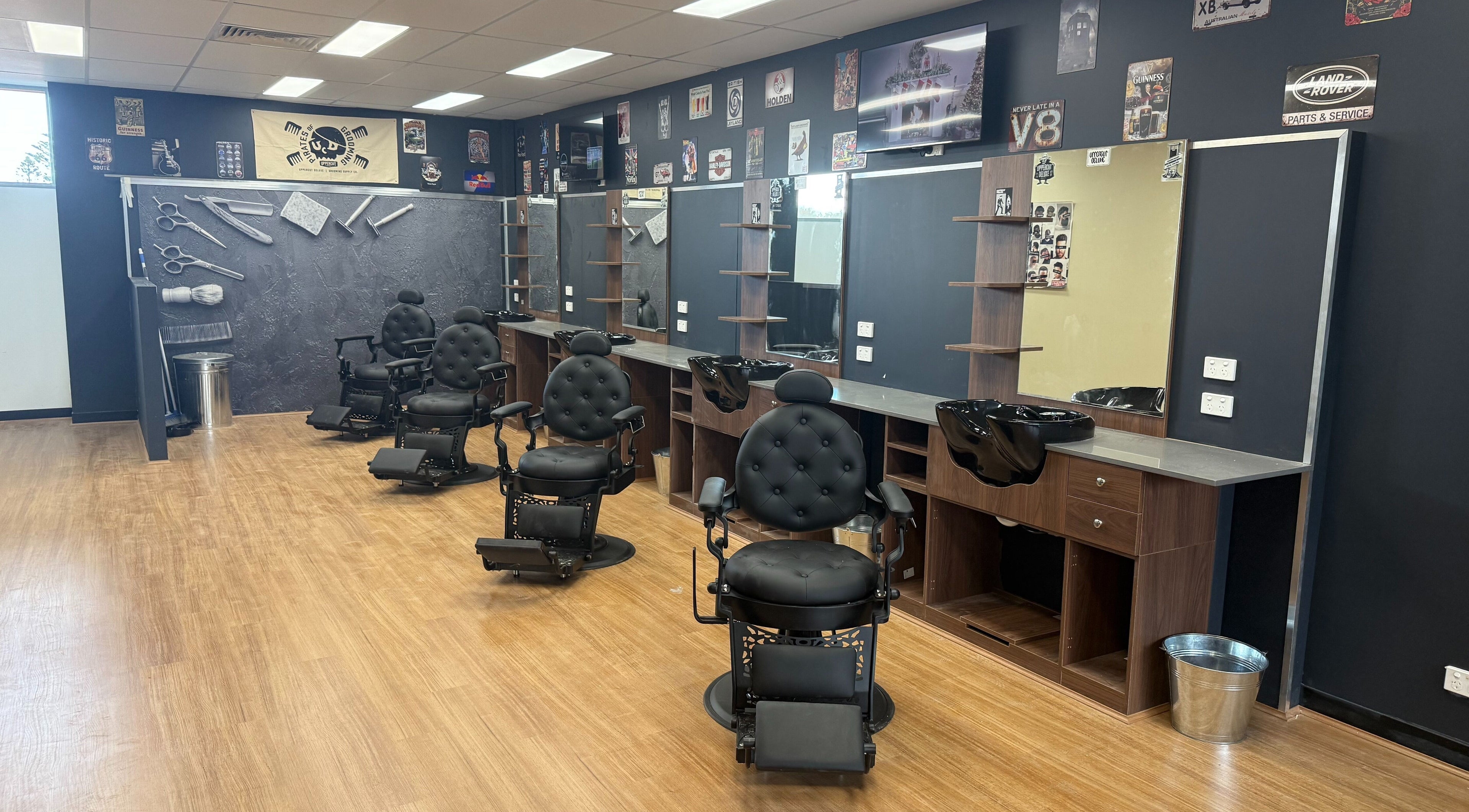 Modern barber chairs and mirrors at The Fade Lounge - Currambine, Western Australia, AU showcasing sleek design.