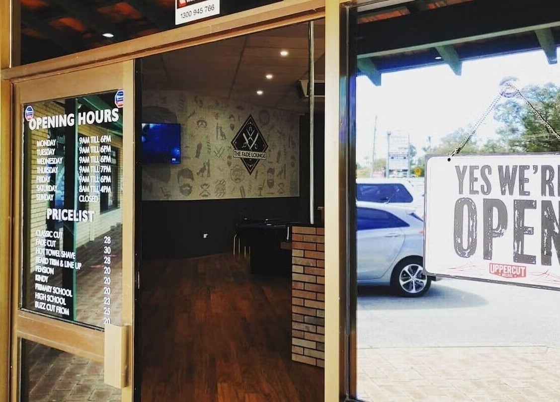 Entrance of The Fade Lounge - Currambine, Western Australia, AU, showing opening hours and 'Yes We're Open' sign.