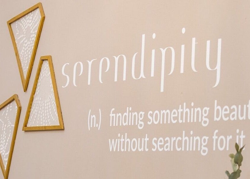 Decorative wall at Serendipity Beauty Studio, George, Western Cape, ZA, featuring an inspirational quote.