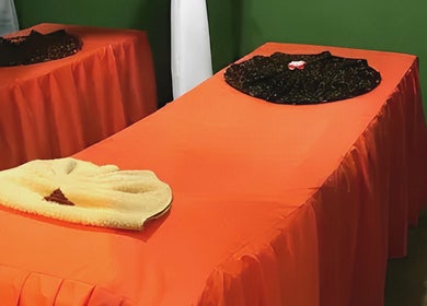 Massage tables at Ranting Spa Kepala Batas Penang, featuring vibrant orange covers, located in Kepala Batas, Penang, MY.