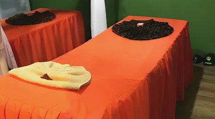 Massage tables at Ranting Spa Kepala Batas Penang, featuring vibrant orange covers, located in Kepala Batas, Penang, MY.