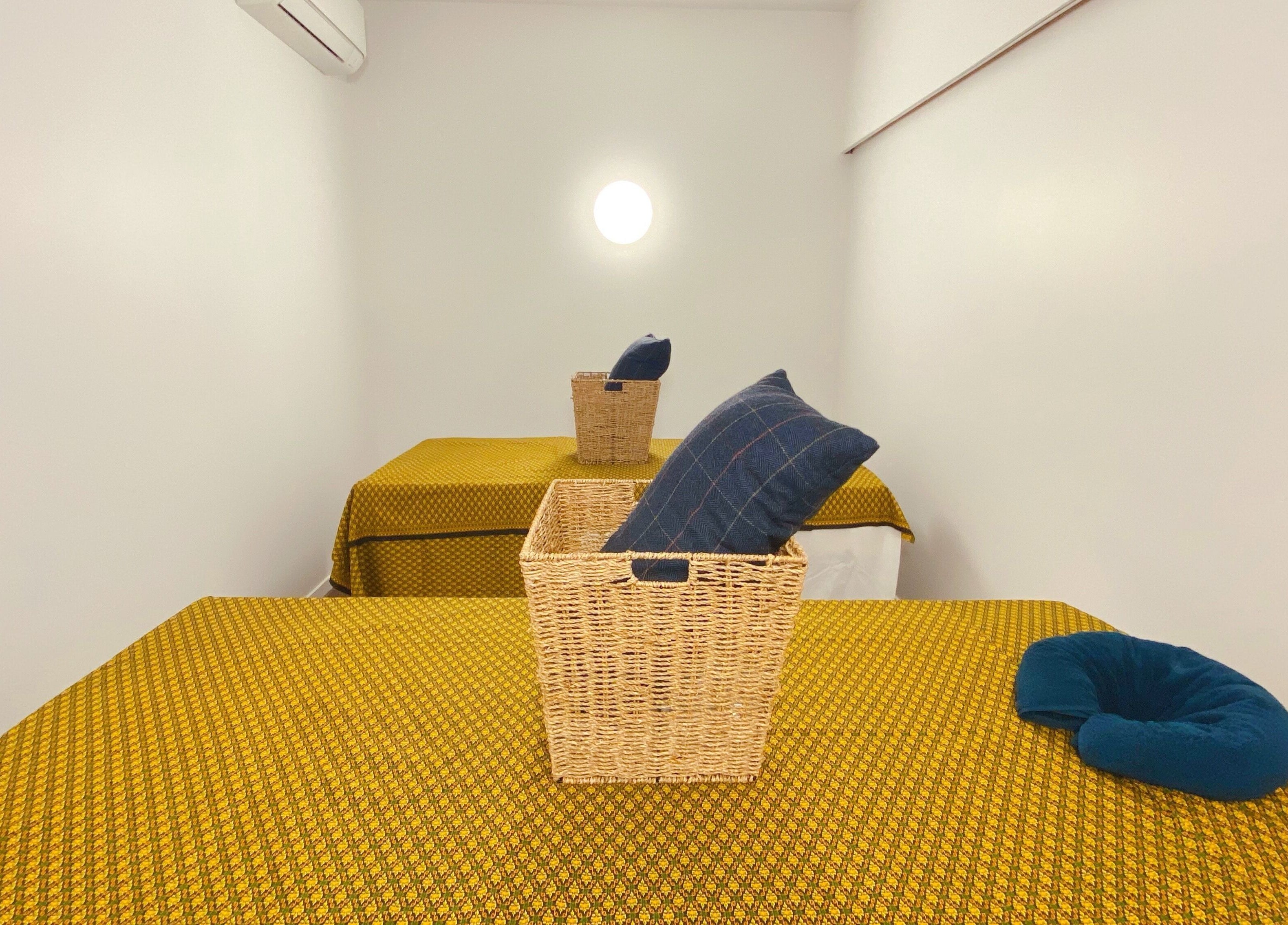 Cozy massage room at Tawee Thai Massage and Spa in Auckland, Auckland, NZ with stylish décor and plush bedding.