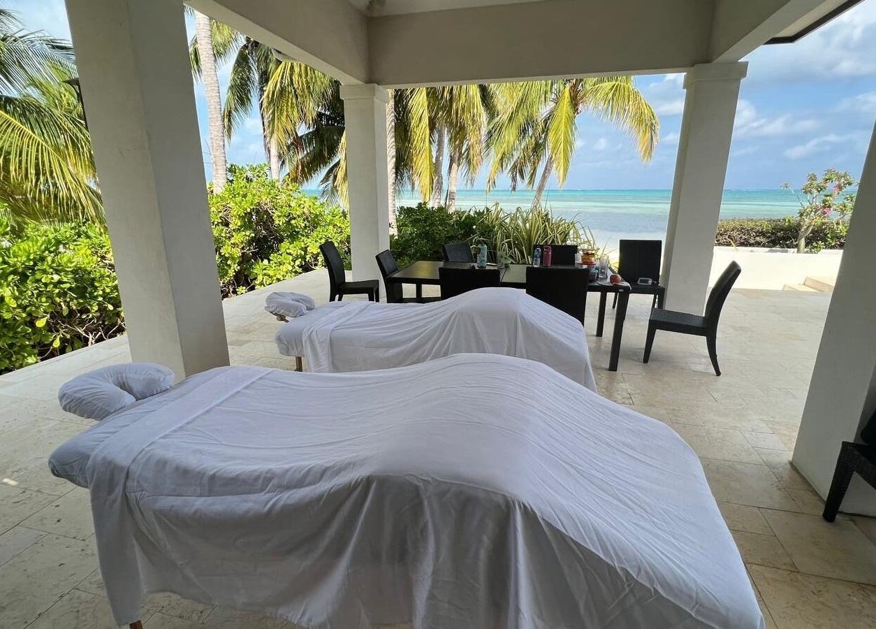 Outdoor massage setup at Molly's Hair and Spa Cayman, Grand Cayman, KY with ocean view.