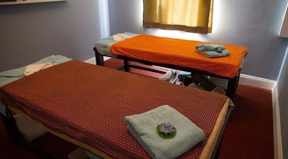Relaxing massage room at Sansiri Thai Massage, Melbourne, Victoria, AU with two treatment tables.