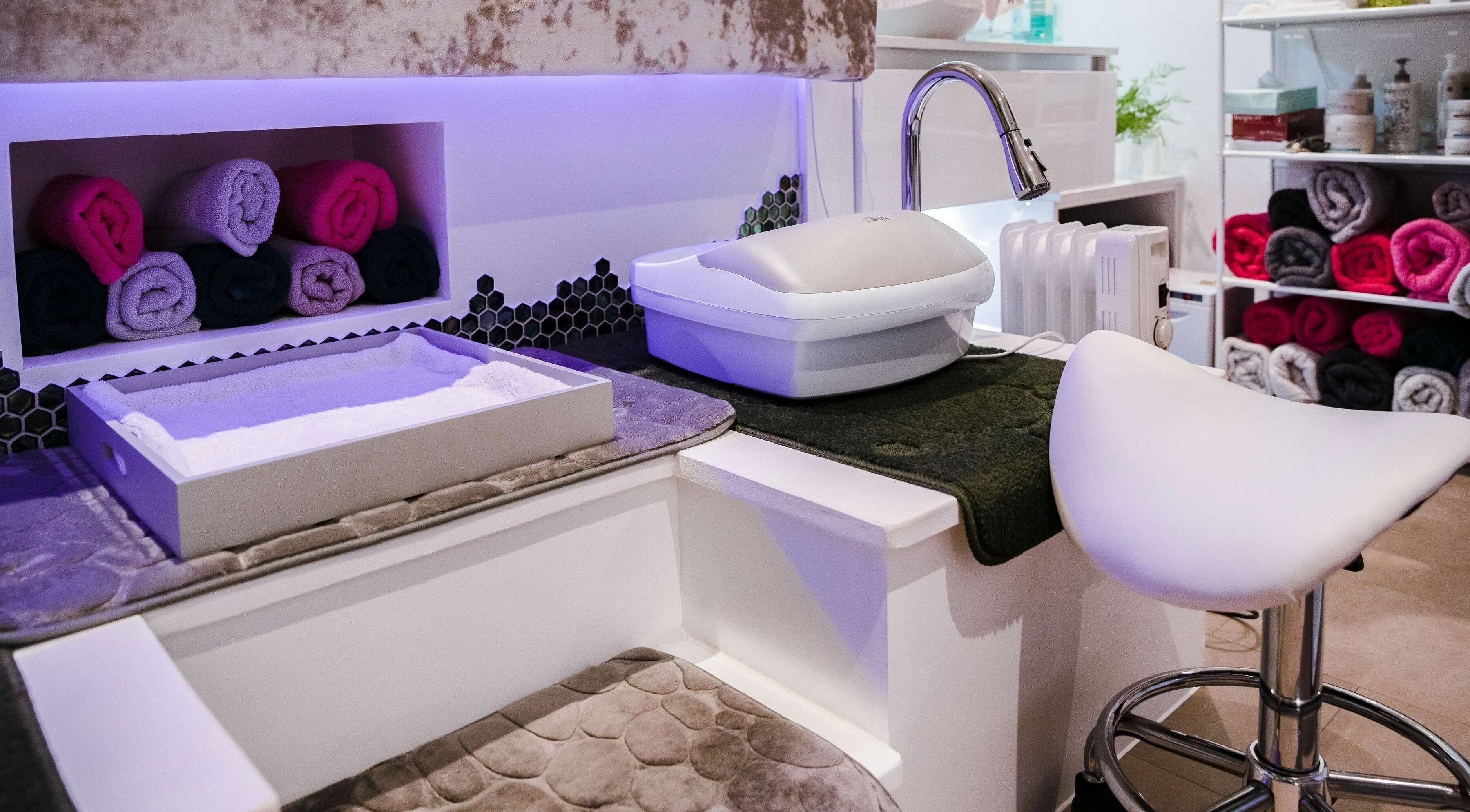 Luxurious nail spa setup featuring plush seating at Pallas Beauty in Dundee, Scotland, GB.