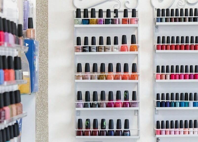 Array of vibrant nail polish bottles at Pallas Beauty, Dundee, Scotland, GB, showcasing diverse color choices.