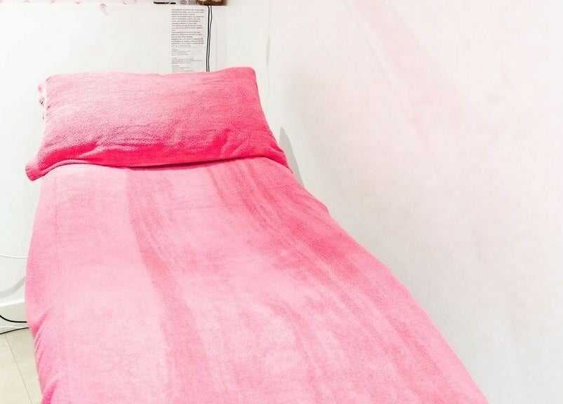 Cozy pink treatment bed at Pallas Beauty, Dundee, Scotland, GB. Relaxing wellness environment.