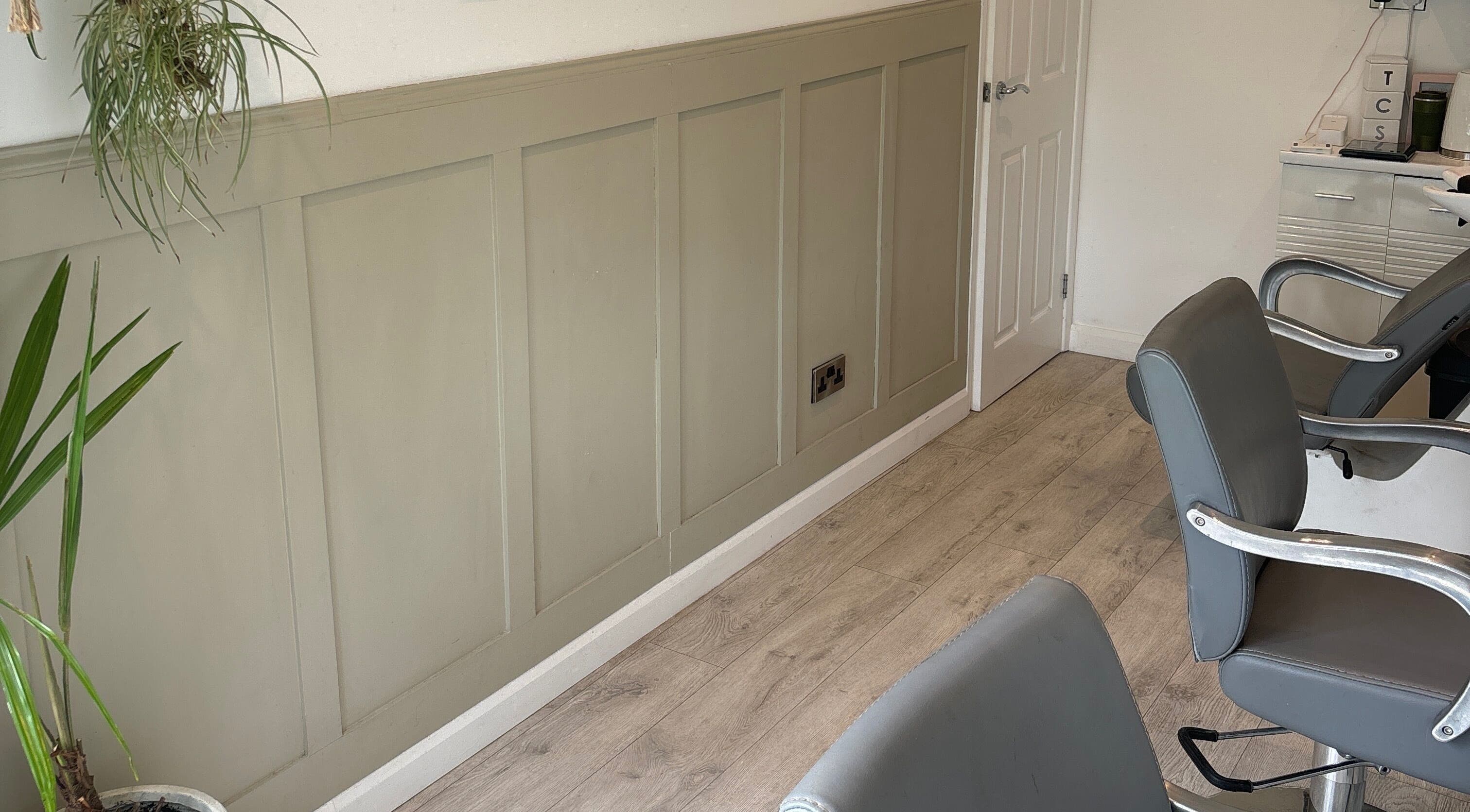 Interior of Amy Newton Hair Design at Cheswick Green, England, featuring stylish salon chairs and modern decor.