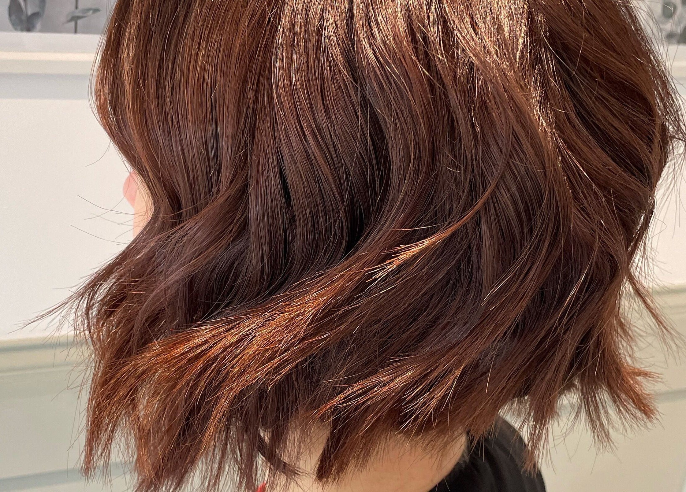 Sleek auburn hairstyle at Amy Newton Hair Design, Cheswick Green, England, GB. Expert hair services showcased.