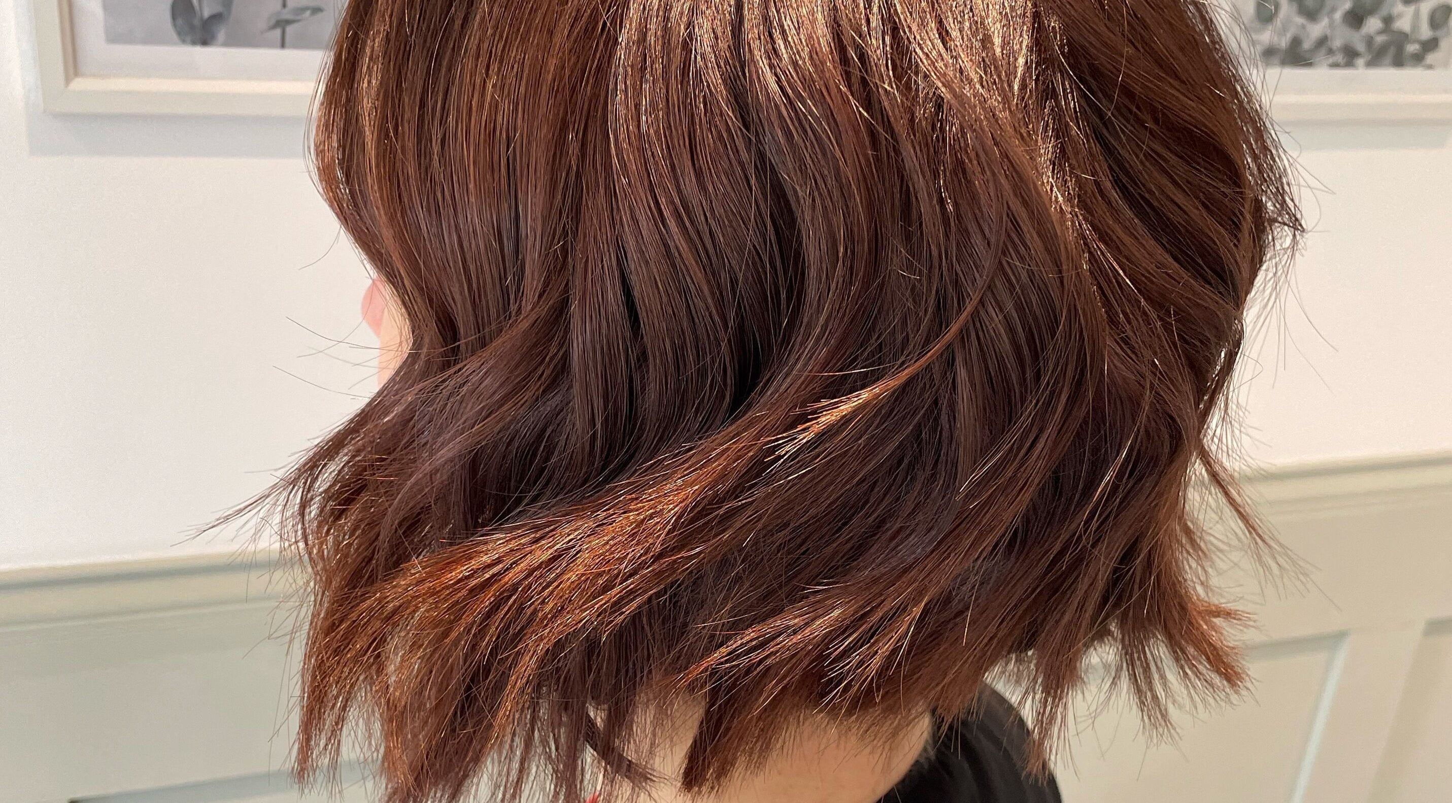 Sleek auburn hairstyle at Amy Newton Hair Design, Cheswick Green, England, GB. Expert hair services showcased.