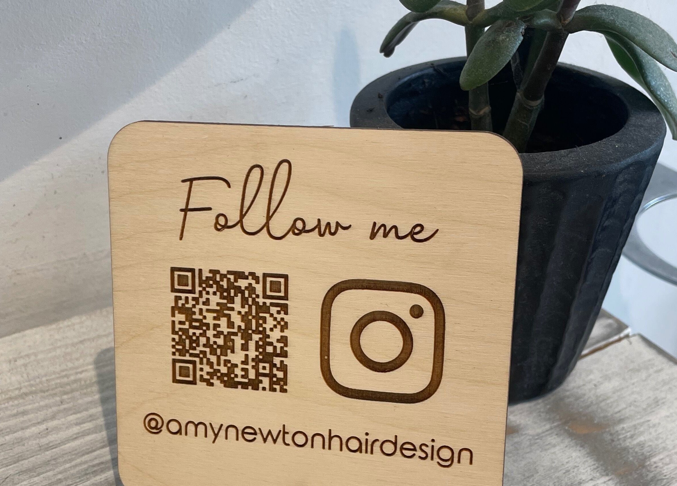 Follow us sign at Amy Newton Hair Design, Cheswick Green, England, GB.