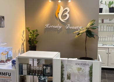 Reception area of Hornsby Beauty Salon in Hornsby, New South Wales, AU with plants and skincare products.