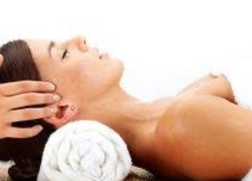 Relaxing head massage at CamelliasBodyMassage, Christchurch, NZ, showcasing tranquility and wellness.