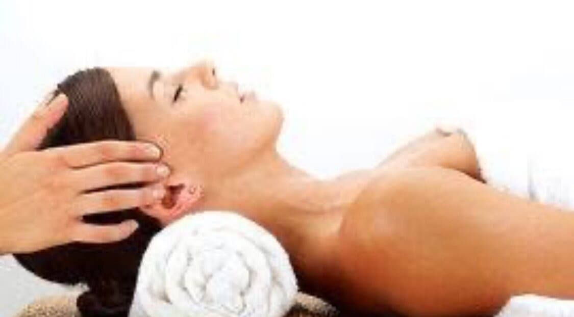 Relaxing head massage at CamelliasBodyMassage, Christchurch, NZ, showcasing tranquility and wellness.