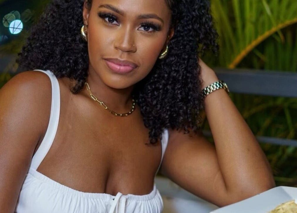 A woman with styled hair at The Brow & Lash Refinery in Kingston, St. Andrew Parish, JM, showcasing beauty.