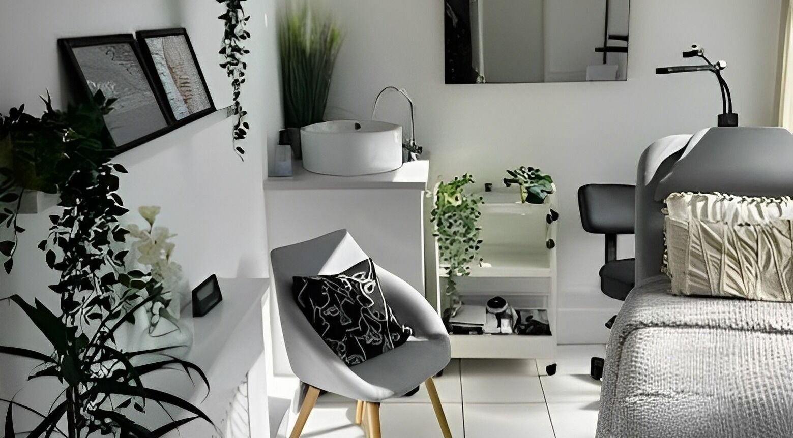 Tribe Beauty Room in Weymouth, England, GB, featuring modern decor with plants and relaxing treatment areas.