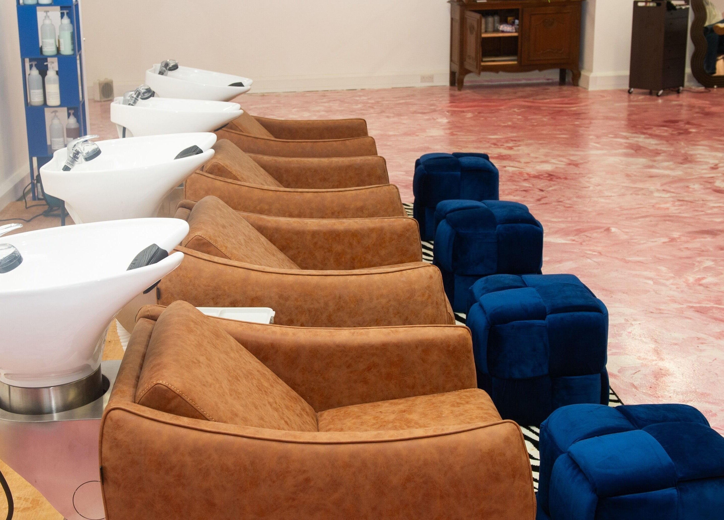 Elegant wash stations at Shag East, London, England, GB. Luxurious seating and sleek design.