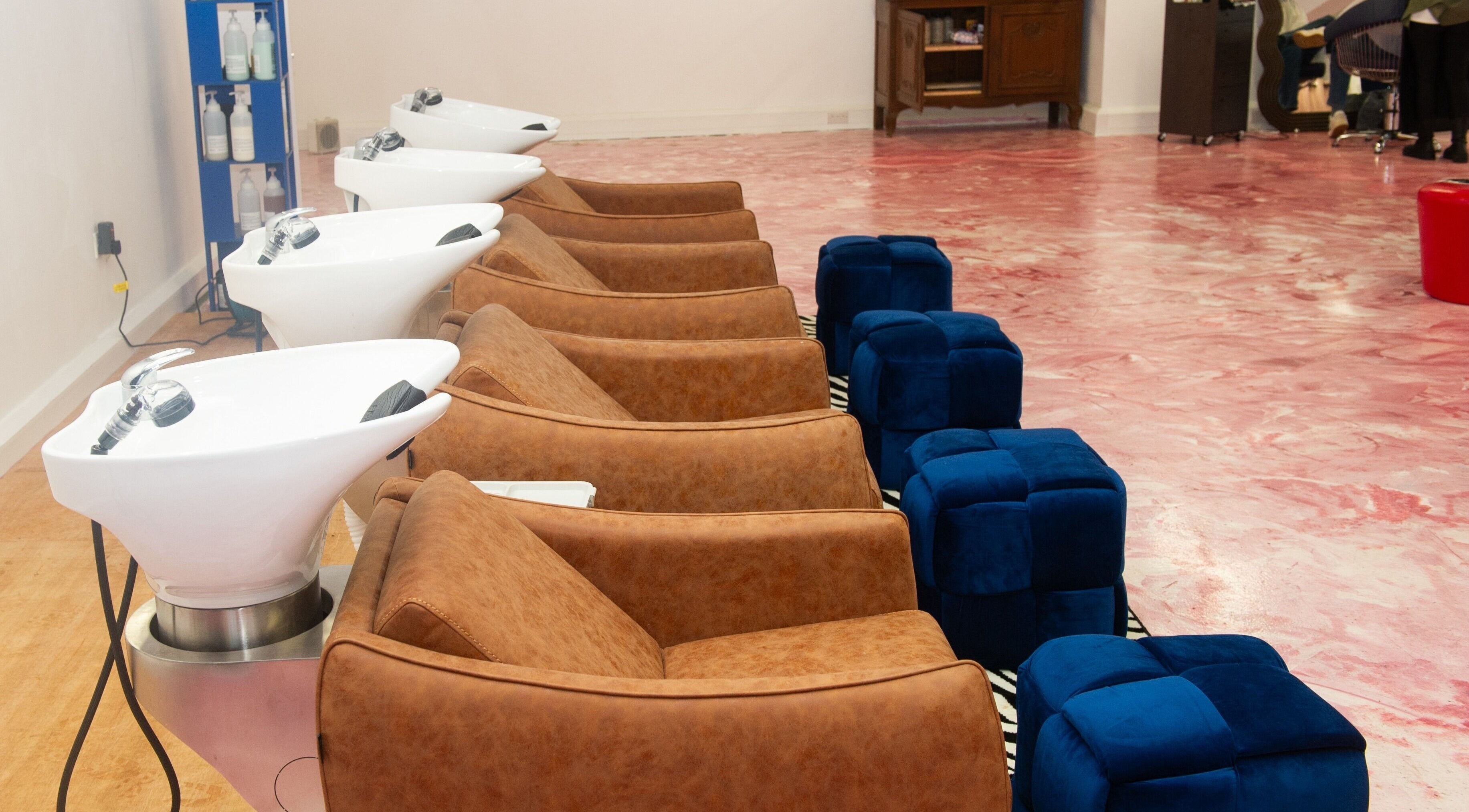 Elegant wash stations at Shag East, London, England, GB. Luxurious seating and sleek design.