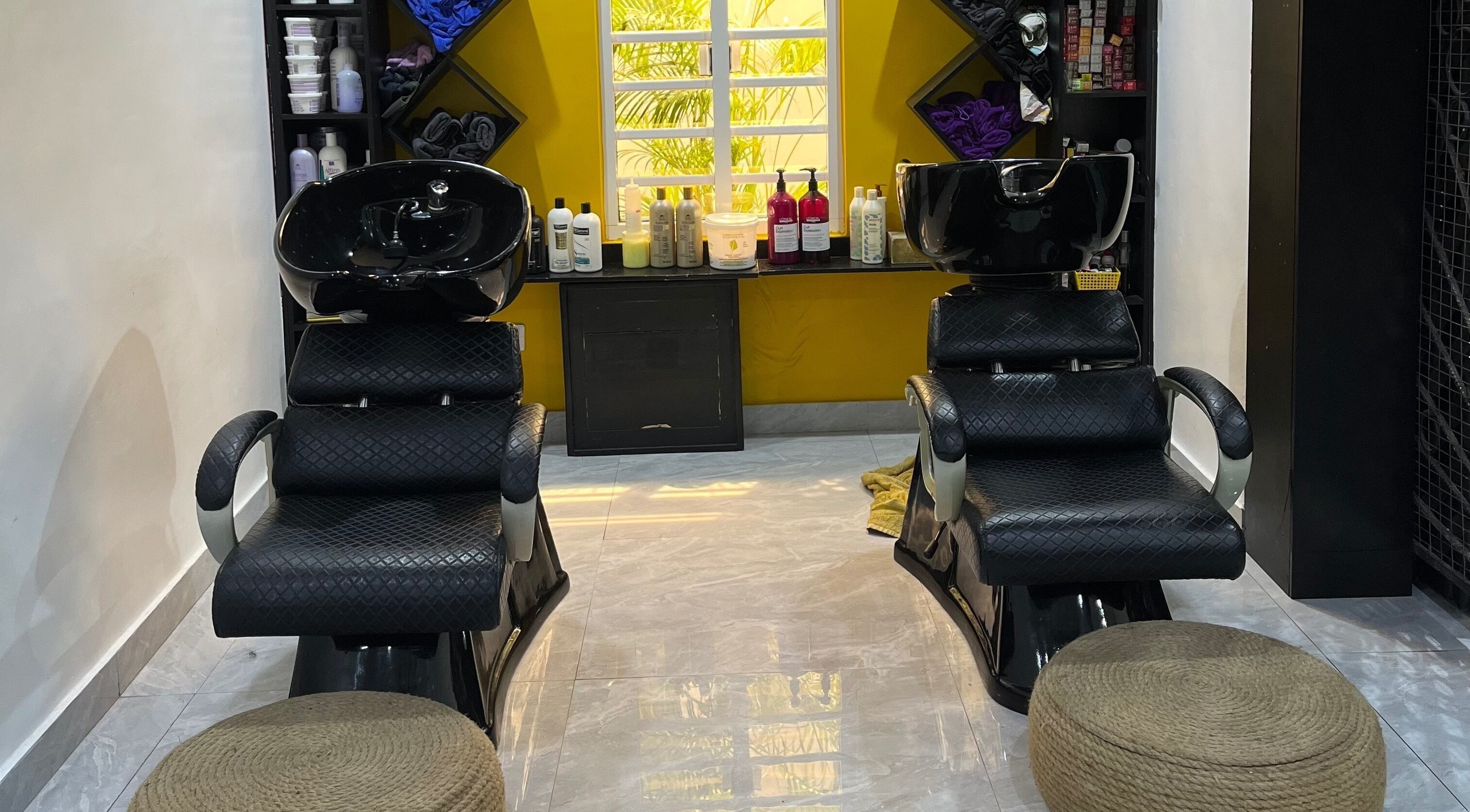 Chic shampoo chairs at Studio M, Lagos, Lagos, NG, offering a relaxing haircare experience.