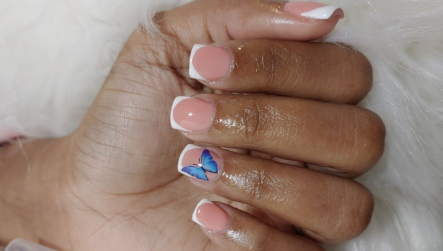 Elegant butterfly nail art at Angelic Beauty - Salon & Supplies Ltd, San Juan, TT.