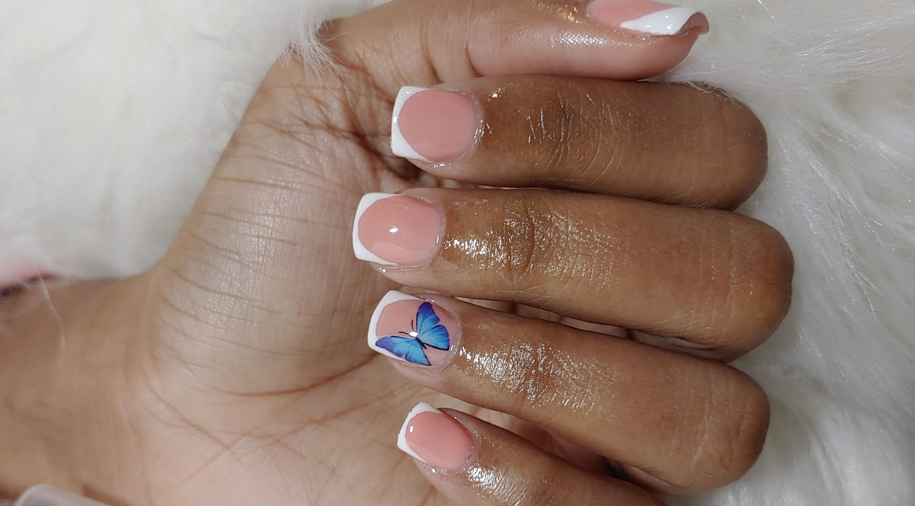 Elegant butterfly nail art at Angelic Beauty - Salon & Supplies Ltd, San Juan, TT.