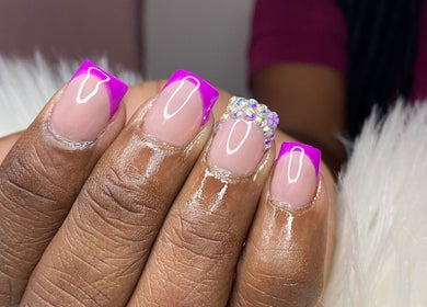 Vibrant pink manicured nails with gems at Angelic Beauty - Salon & Supplies Ltd, San Juan, TT.
