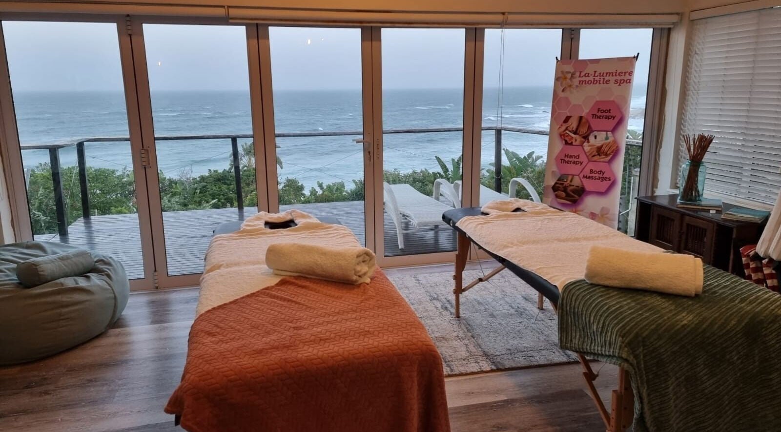 Relaxing oceanfront massage room at La-Lumiere Mobile Spa, Margate, Kwazulu-natal, ZA. Inviting ambiance.