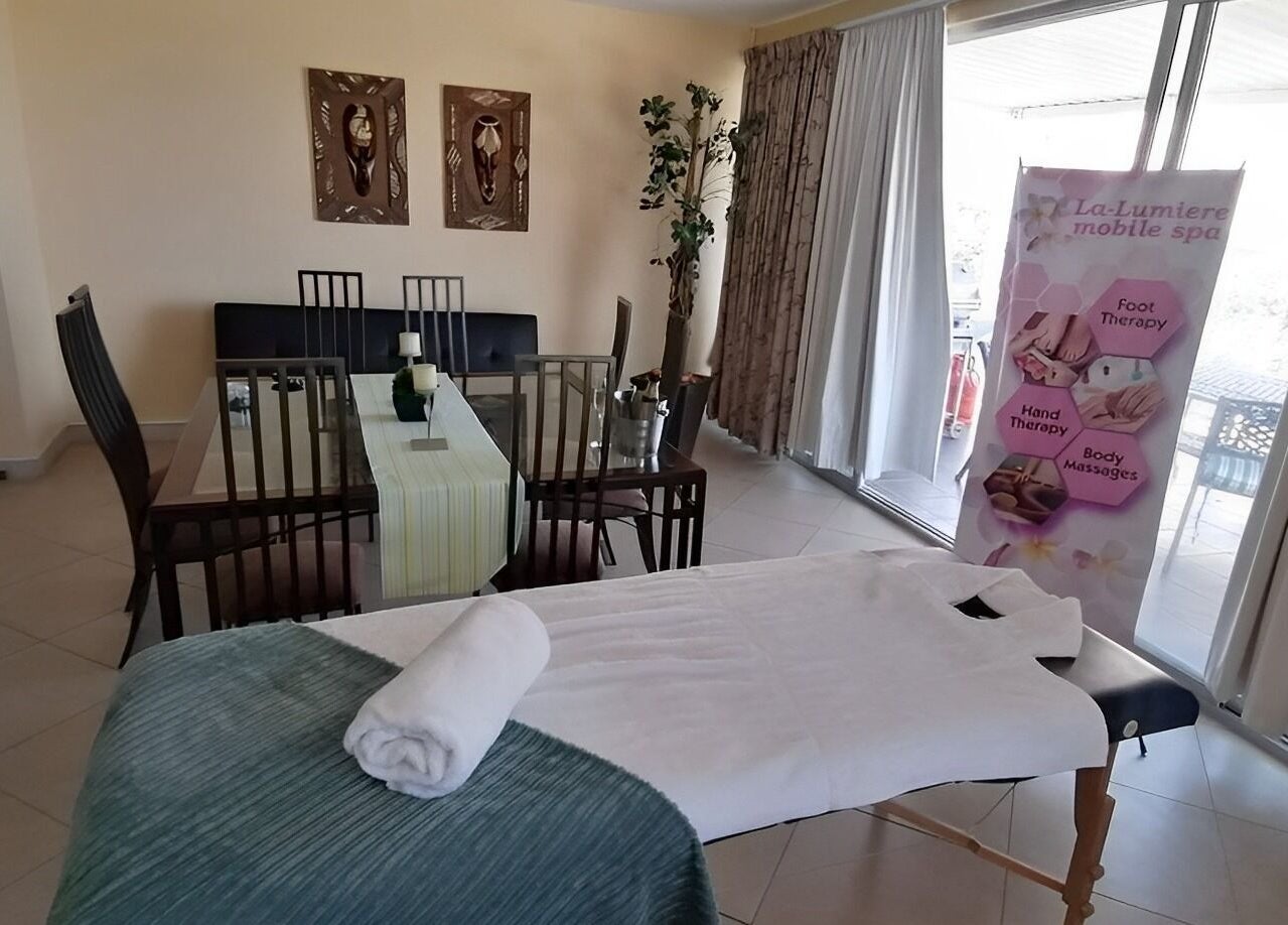Relaxing treatment area at La-Lumiere Mobile Spa in Margate, Kwazulu-natal, ZA, featuring massage table.