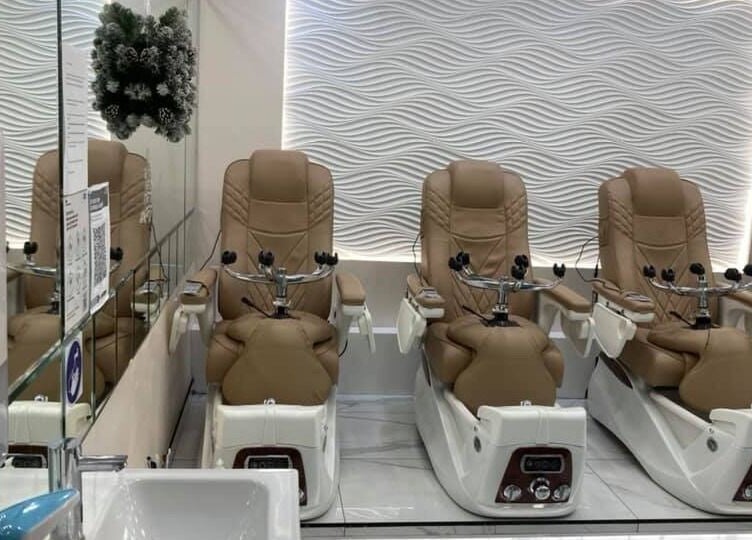 Luxurious pedicure chairs at Absolute Joy Spa in London, England, GB, promising ultimate relaxation.